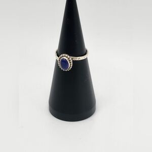 Size 7.5 sterling silver VERY pretty ring.  I think this is lapis blue stone.